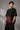 Black oversized t-shirt featuring a powerful Shiv Shakti graphic in red and grey. DTF print highlights vibrant colors and durable quality.