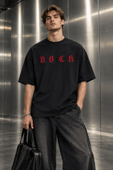 Black oversized tshirt with ROCK in bold red gothic old english lettering on front, Roman Empire WWE design, drop shoulder boxy fit, men India - black