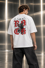 Black oversized tshirt with ROCK in bold red gothic old english lettering on front, Roman Empire WWE design, drop shoulder boxy fit, men India - white