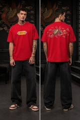 Black oversized t-shirt with Tibetan script in red on golden decorative banner, spiritual streetwear India - red