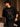 Back view of a man wearing a black UNBREAKABLE TIGER oversized t-shirt, featuring a subtle tonal logo on the upper back. Streetwear aesthetic.