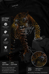Back view of a man wearing a black UNBREAKABLE TIGER oversized t-shirt, featuring a subtle tonal logo on the upper back. Streetwear aesthetic.