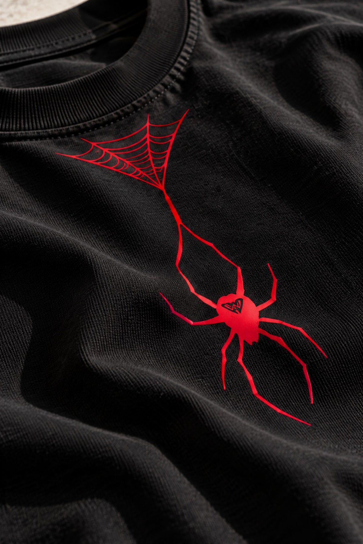 Black oversized tshirt with bold red spider web and hanging spider illustration, urban streetwear print, drop shoulder boxy fit, men India