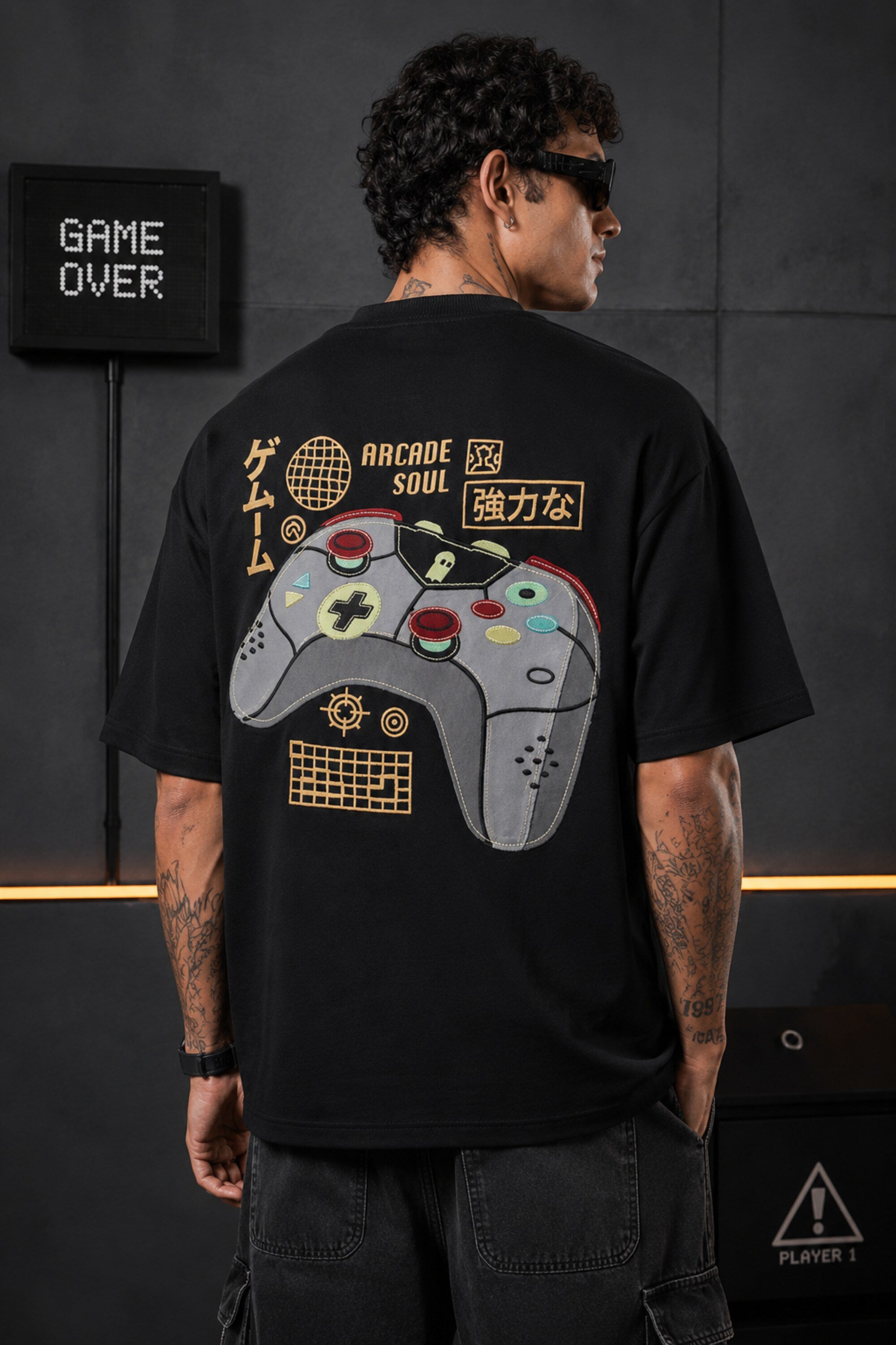 Black oversized t-shirt with retro golden game controller and Japanese passion kanji print, gamer streetwear India