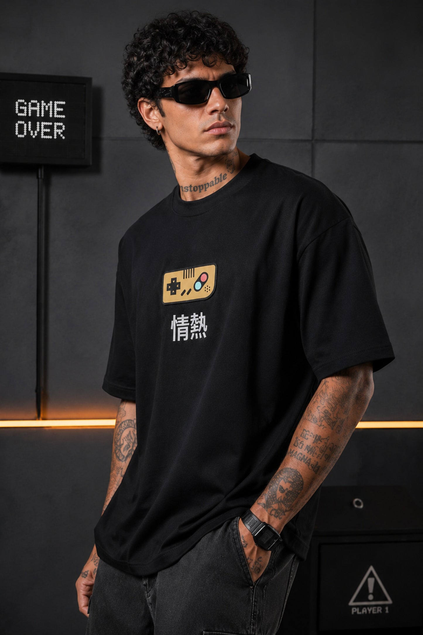Black oversized t-shirt with retro golden game controller and Japanese passion kanji print, gamer streetwear India