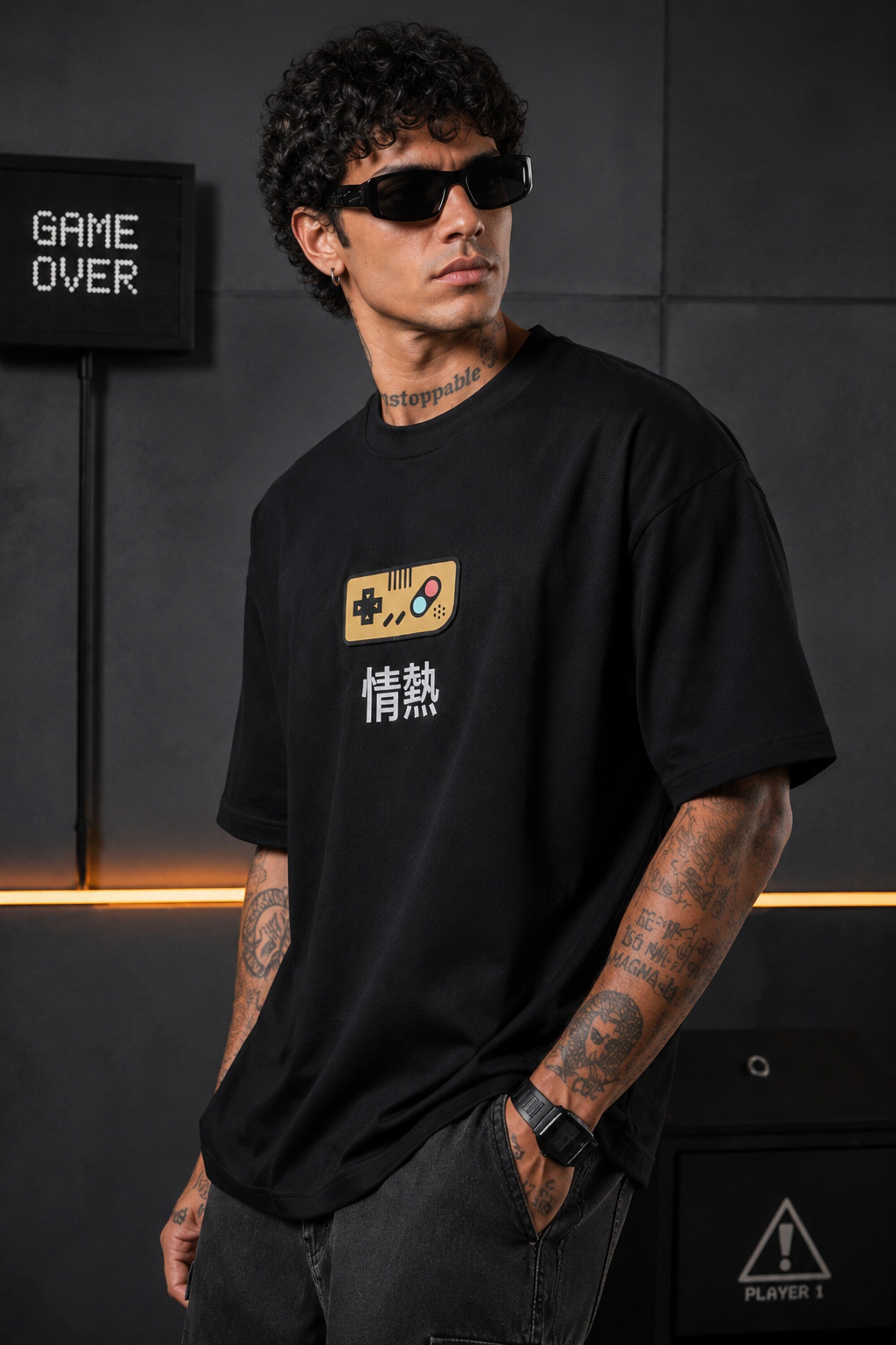 Black oversized t-shirt with retro golden game controller and Japanese passion kanji print, gamer streetwear India