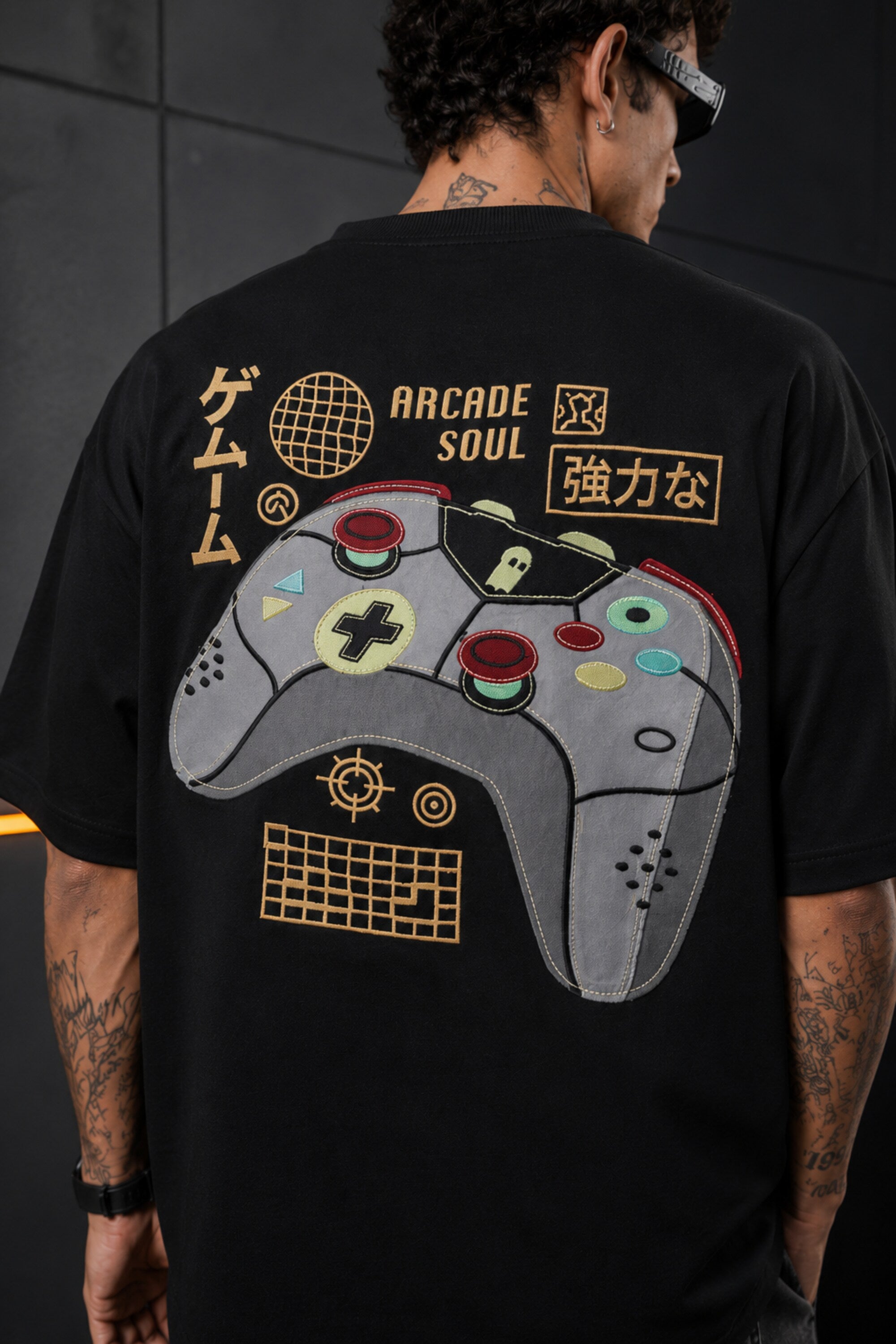 Black oversized t-shirt with retro golden game controller and Japanese passion kanji print, gamer streetwear India
