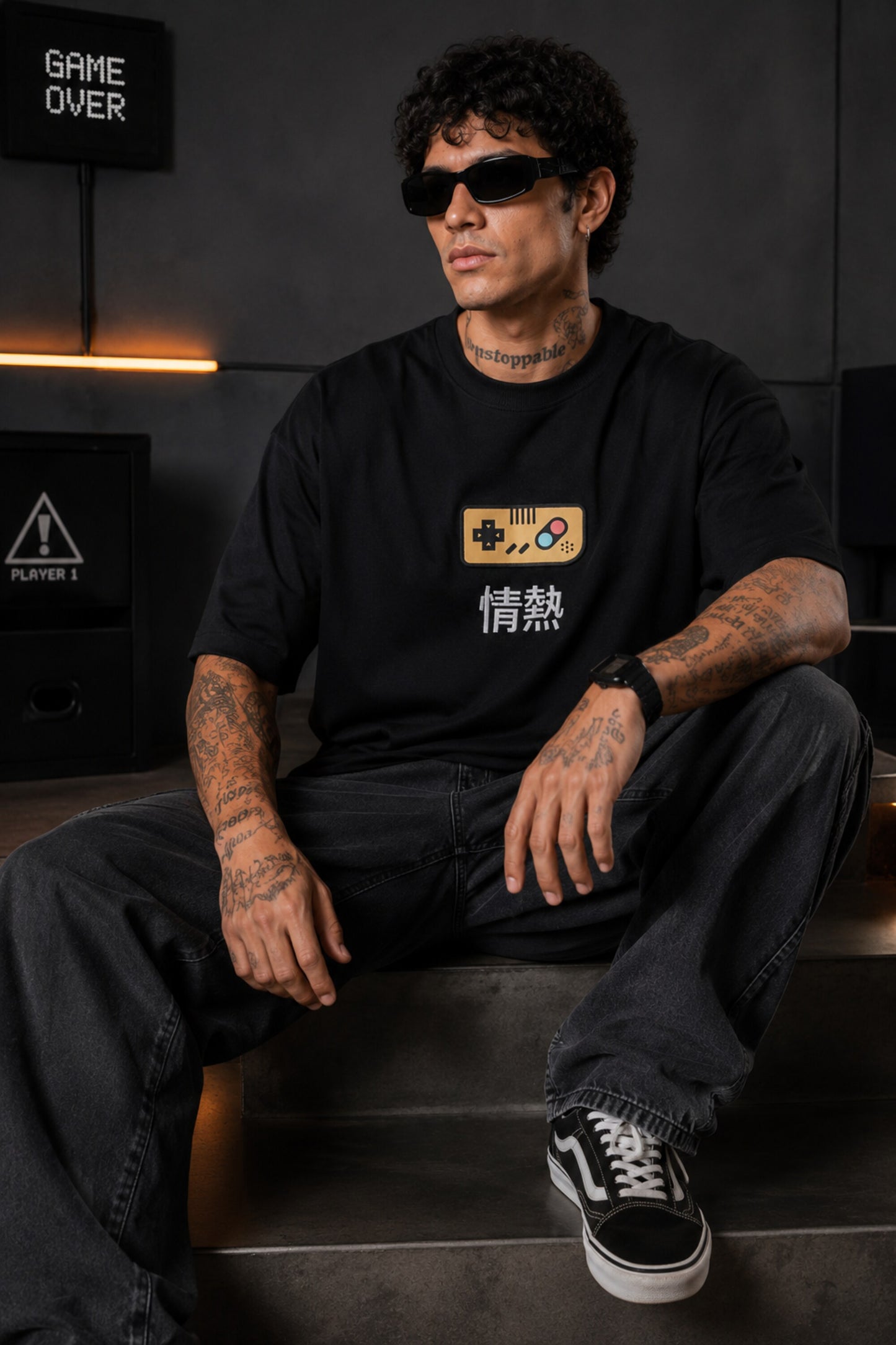 Black oversized t-shirt with retro golden game controller and Japanese passion kanji print, gamer streetwear India
