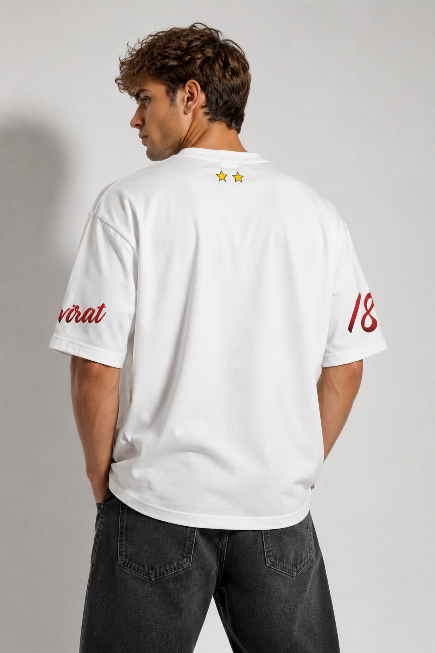 White oversized t-shirt with RCB Royal Challengers Bangalore lion crest number 18 and virat red cursive on sleeves red side stripes