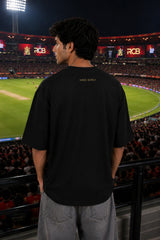 Black oversized t-shirt with RCB Champion 2026 gold lion crest forever rcb red stripe and number 18 on sleeve 220 GSM DTF