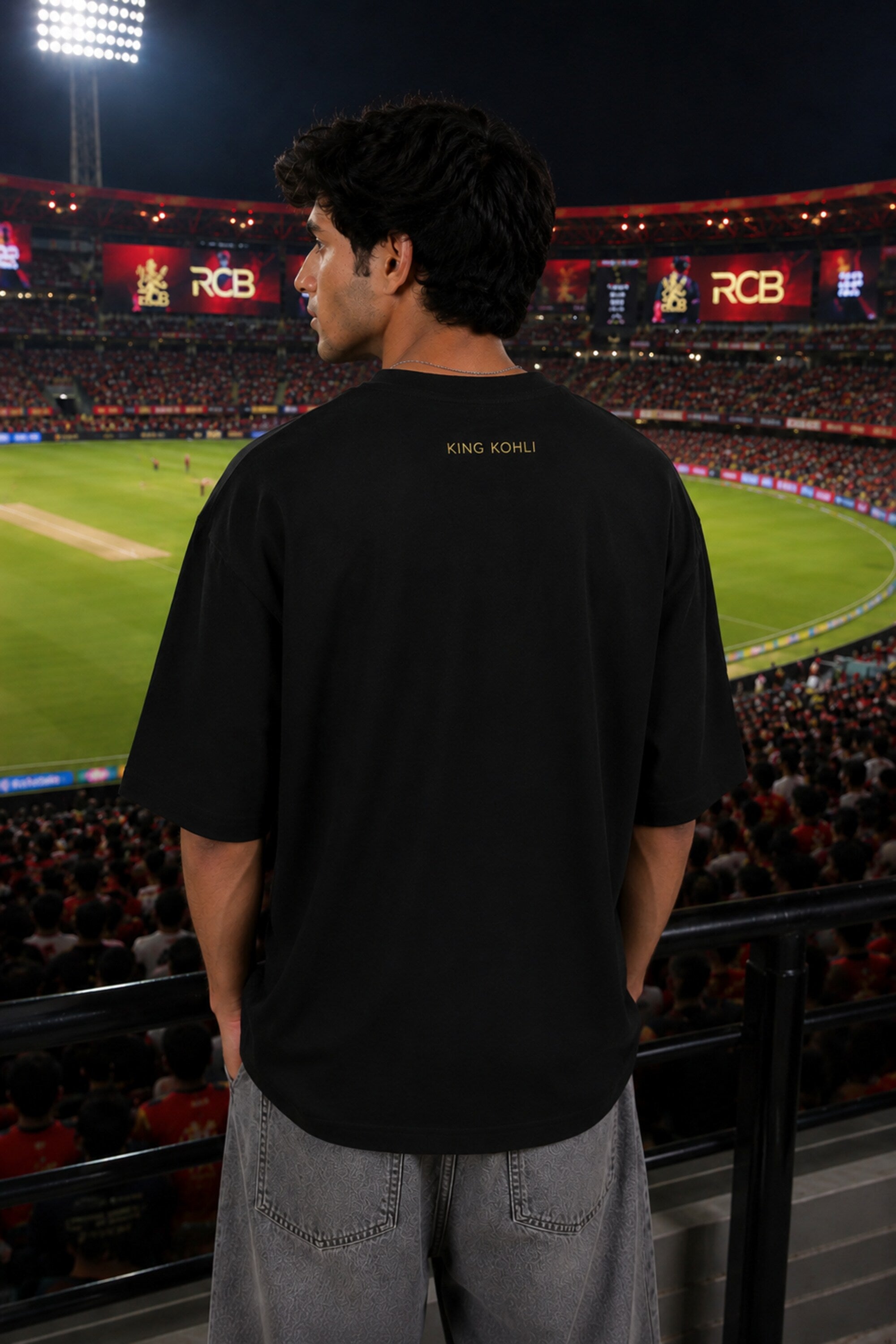 Black oversized t-shirt with RCB Champion 2026 gold lion crest forever rcb red stripe and number 18 on sleeve 220 GSM DTF