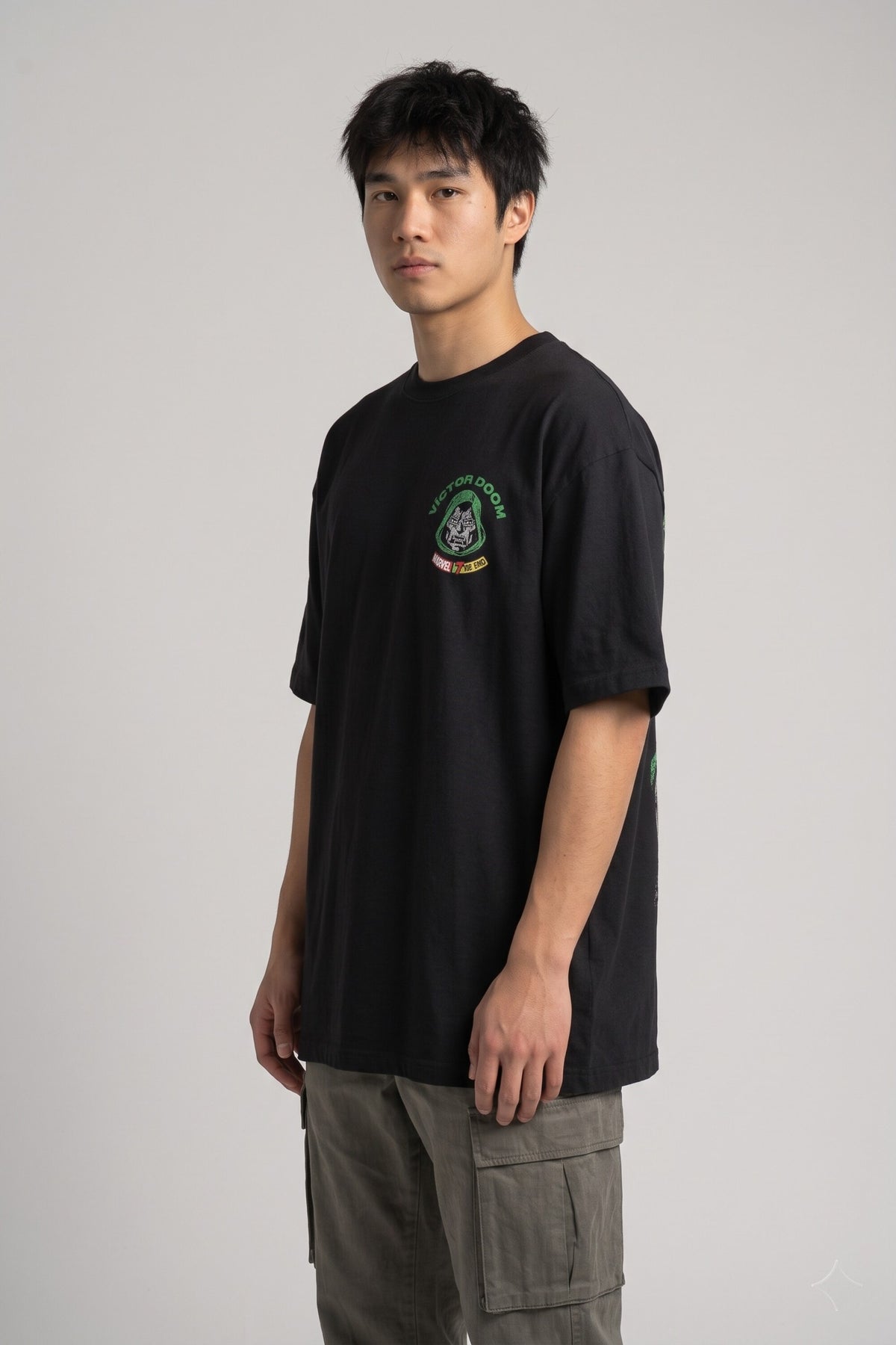 Black oversized tshirt with Marvel logo bold VICTOR green text and Dr Doom full-body illustration on back, drop shoulder boxy fit, men India - doom design shot 2