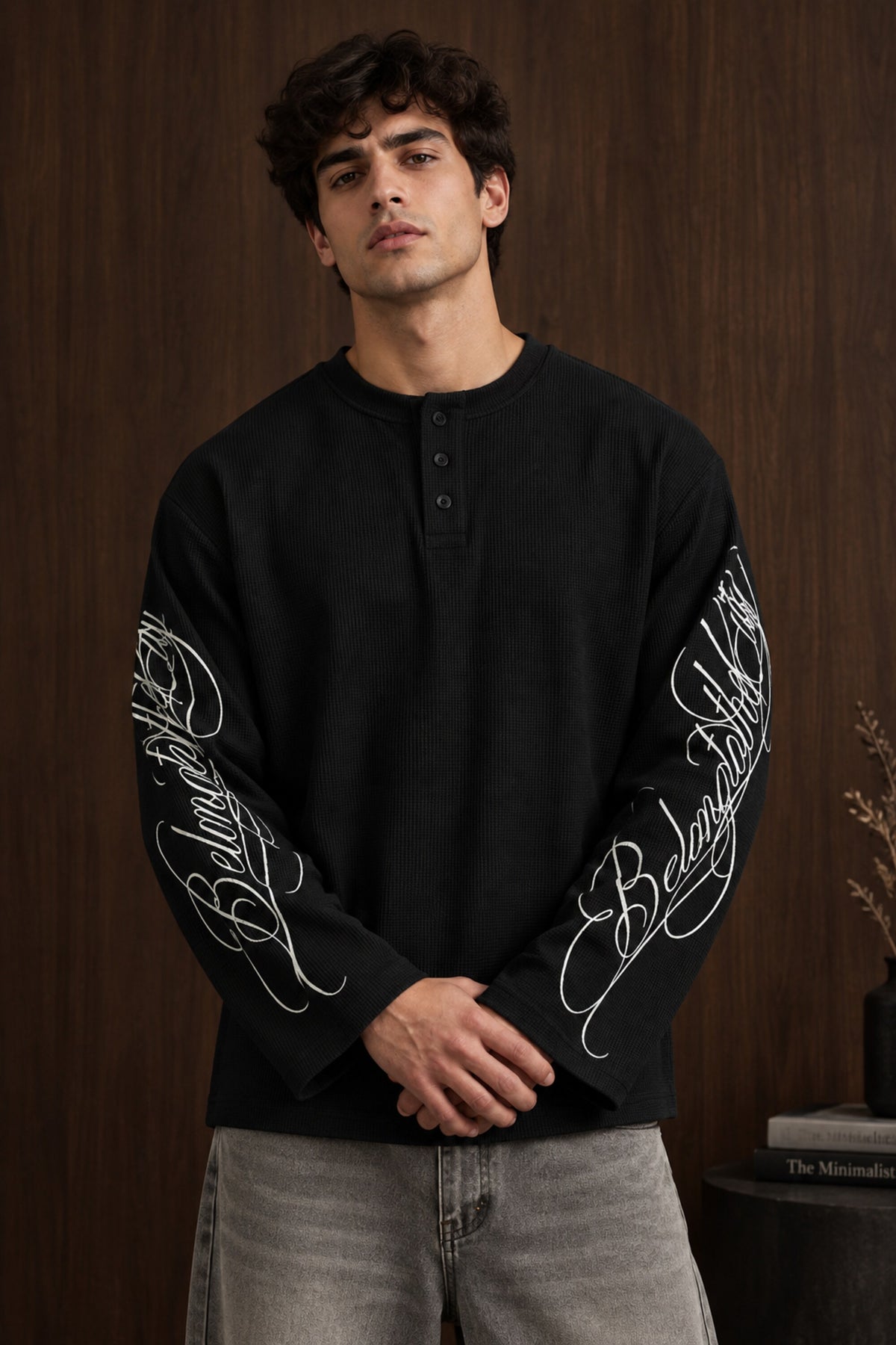 Black waffle full sleeve boxy fit tshirt with henley collar and white cursive script sleeve print, men India - black