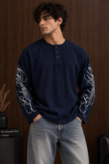 Black waffle full sleeve boxy fit tshirt with henley collar and white cursive script sleeve print, men India - blue