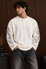 Black waffle full sleeve boxy fit tshirt with henley collar and white cursive script sleeve print, men India - white
