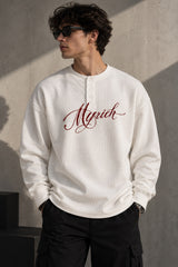 White waffle full sleeve tshirt with boxy fit, henley collar and Munich cursive script print on chest, men India