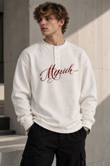 White waffle full sleeve tshirt with boxy fit, henley collar and Munich cursive script print on chest, men India