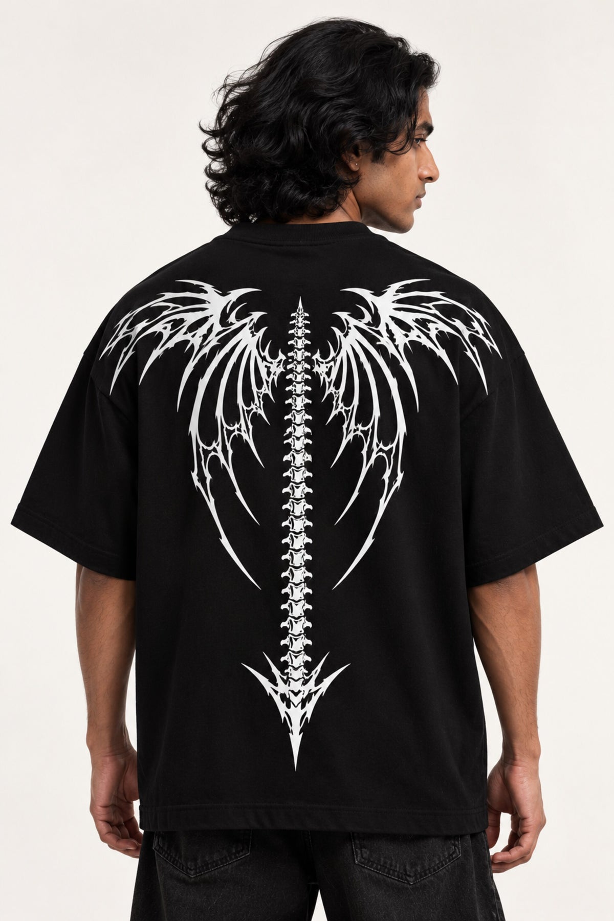 Black oversized tshirt with death metal text on front and white dark angel wings spine graphic on back, drop shoulder boxy fit, men India