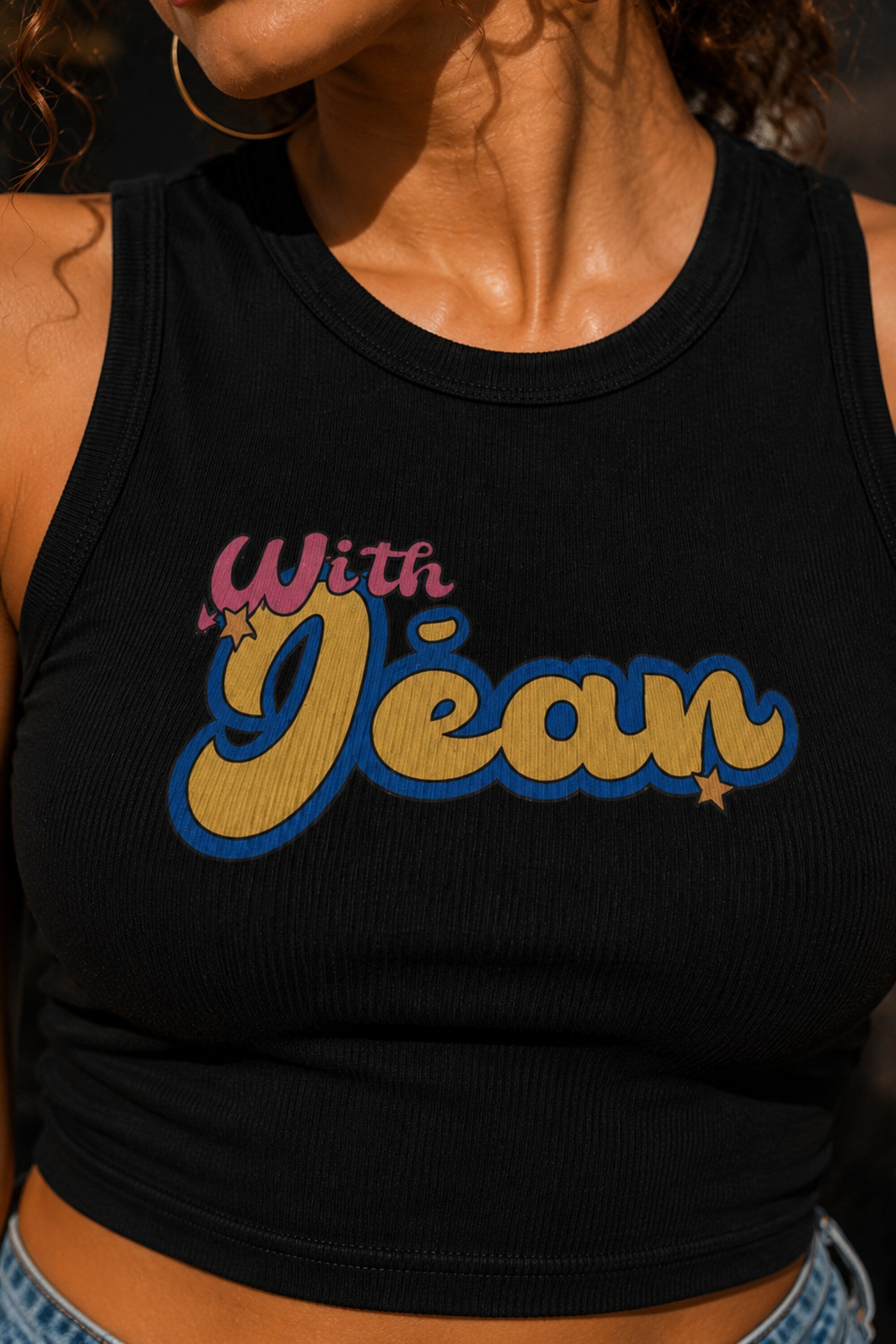 Black ribbed racerback crop tank top with With Jean retro groovy pink cursive and yellow blue text graphic Y2K aesthetic women top