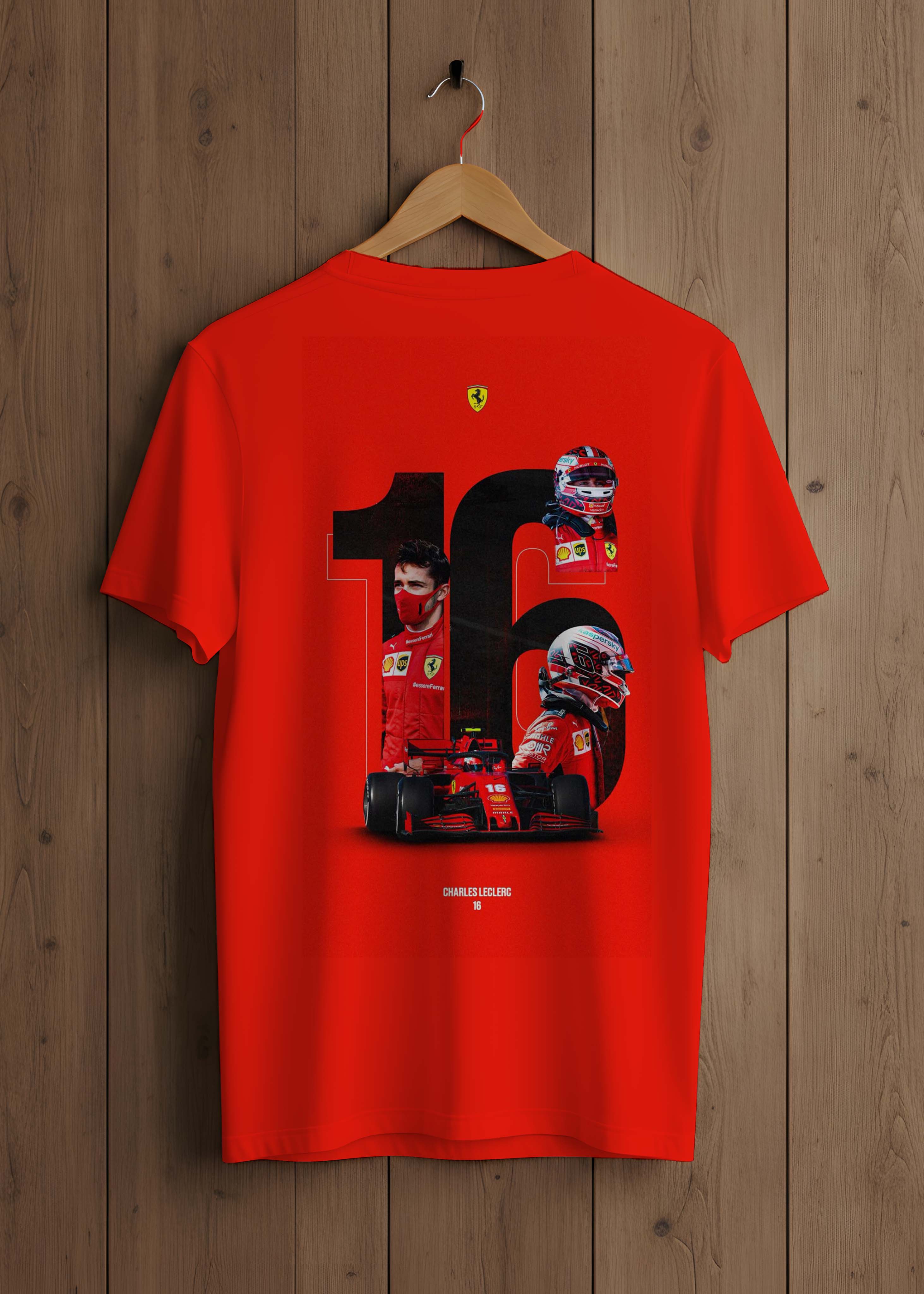 Red t-shirt with Formula 1-themed design on a wooden hanger against a wooden background