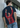 Person wearing a t-shirt with a graphic design of a person in a red jacket.