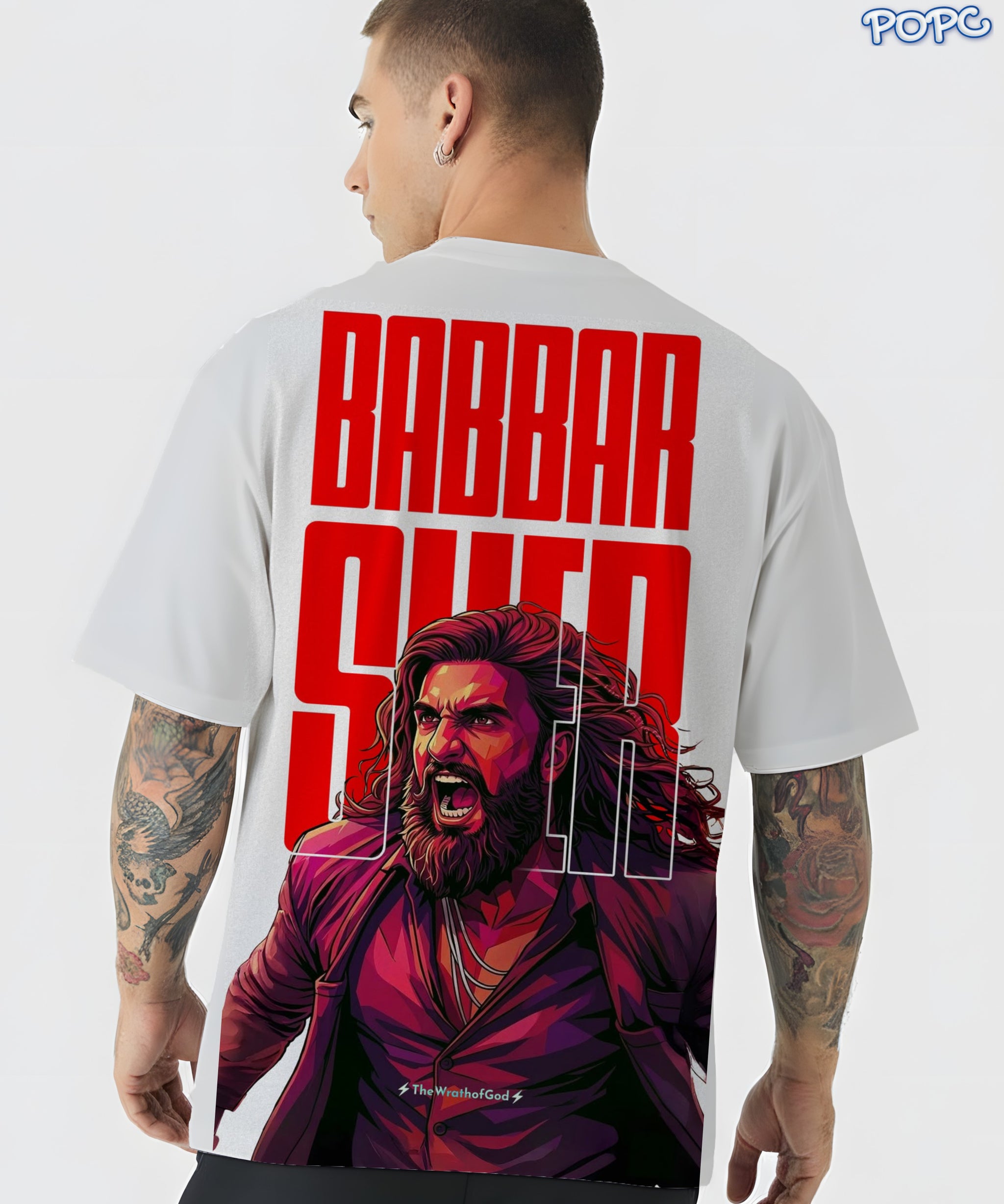 Person wearing a t-shirt with a graphic design and text on the back