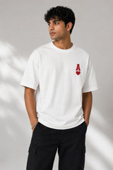 Man wearing a white oversized t-shirt with a large red Ace of Hearts graphic and 'pretty lucky' text on the back. Streetwear fashion. - white