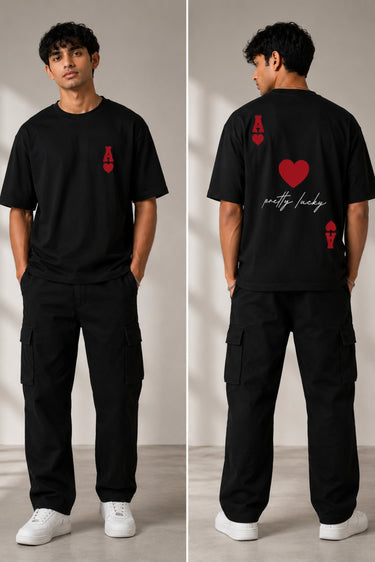 Man wearing a white oversized t-shirt with a large red Ace of Hearts graphic and 'pretty lucky' text on the back. Streetwear fashion. - black