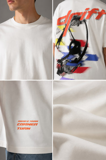 Red oversized t-shirt with 'Drift' graphic print in white and abstract black and yellow brush strokes. Focus on fabric texture and crew neckline.
