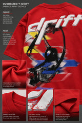 Red oversized t-shirt with 'Drift' graphic print in white and abstract black and yellow brush strokes. Focus on fabric texture and crew neckline.