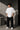 McLaren Formula 1 '2025 MCL39' design on a white oversized t-shirt, featuring a graphic of the F1 car on a checkered flag. Showcasing premium cotton fabric.
