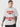 Man wearing a white t-shirt with red and black text on a white background