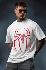 Man wearing a white t-shirt with a red spider graphic and text on a dark background