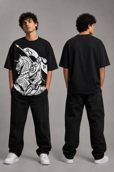 Man wearing a black kuwansugg DESIGN oversized t-shirt with a white graphic print of a knight on a horse. The t-shirt is made of premium cotton. - black