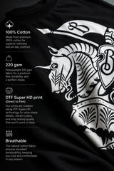 Man wearing a black kuwansugg DESIGN oversized t-shirt with a white graphic print of a knight on a horse. The t-shirt is made of premium cotton.