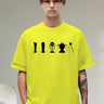 Person wearing a bright yellow t-shirt with black graphics on a neutral background