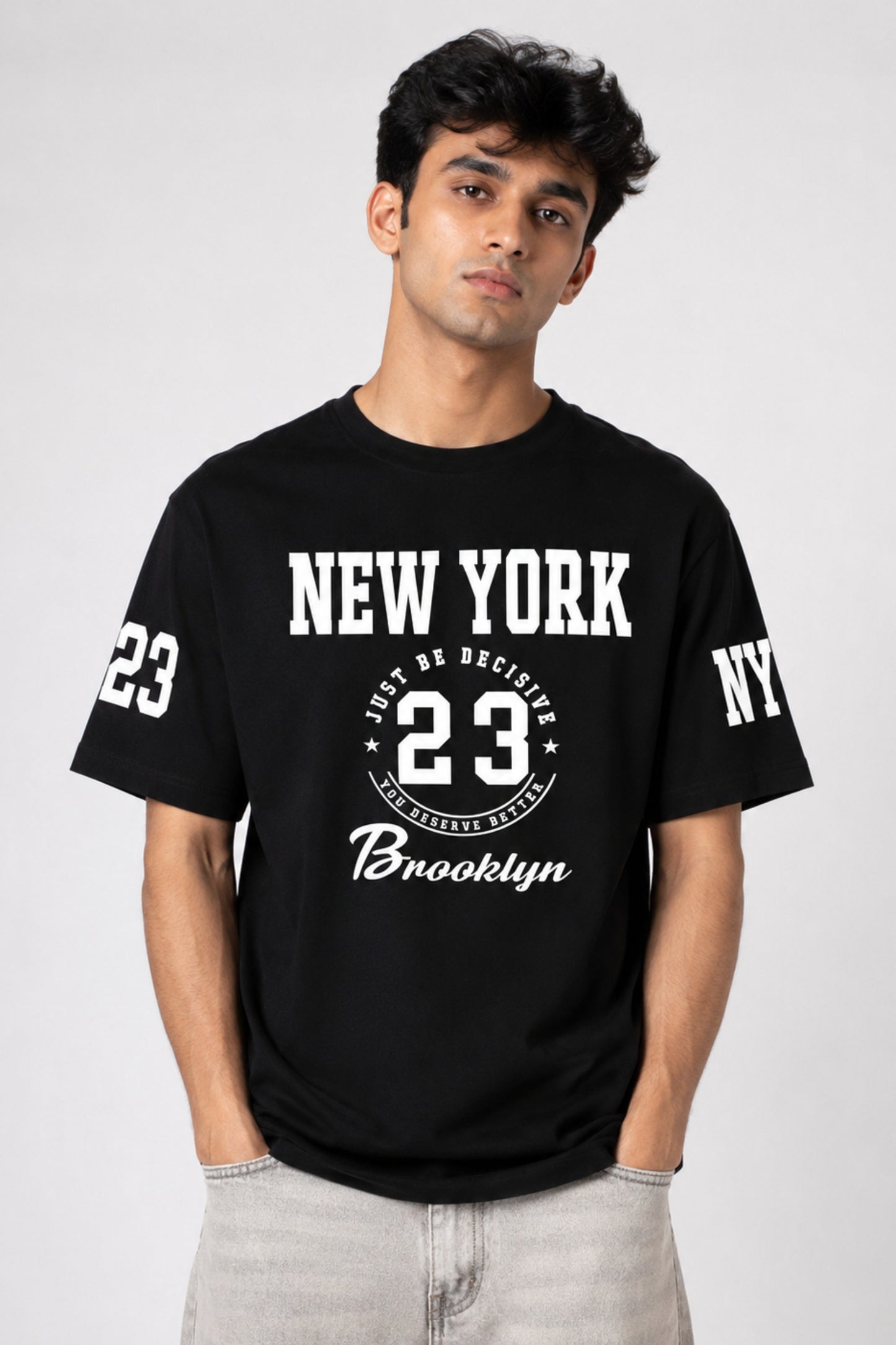 Man wearing a black t-shirt with 'New York 23 Brooklyn' text on a white background