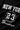 Black t-shirt with white text and numbers on a dark background