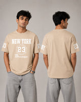 Man wearing a beige t-shirt with 'New York 23 Brooklyn' text, showing front and back views against a gray background.