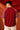 Dark red POPCASE 'Unstoppable' oversized t-shirt with white raised print, featuring ethnic patterned sleeves. Close-up shot showcasing fabric texture and print detail.