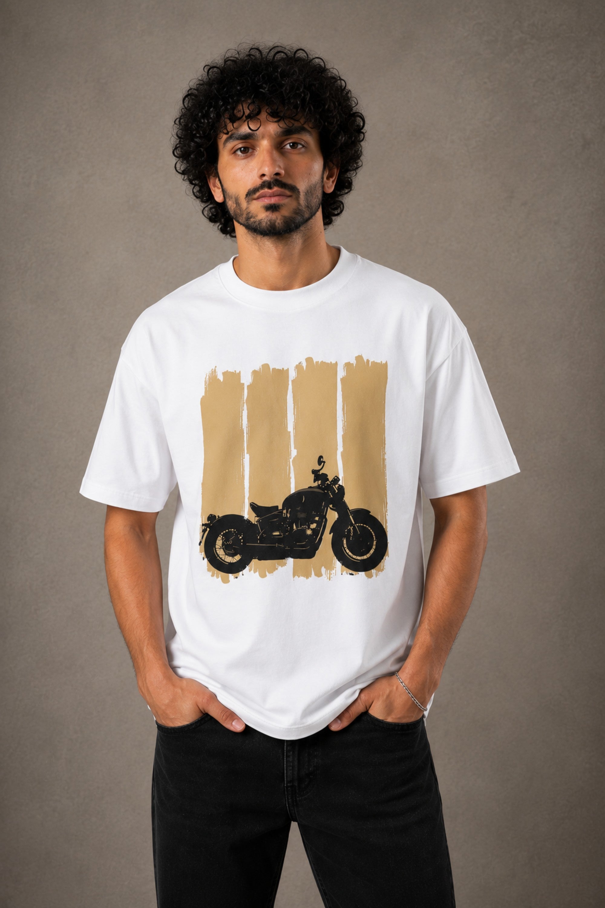 Back view of a man wearing an ENFIELD DESIGN black oversized t-shirt against a textured grey background. Features relaxed fit and premium cotton. - white