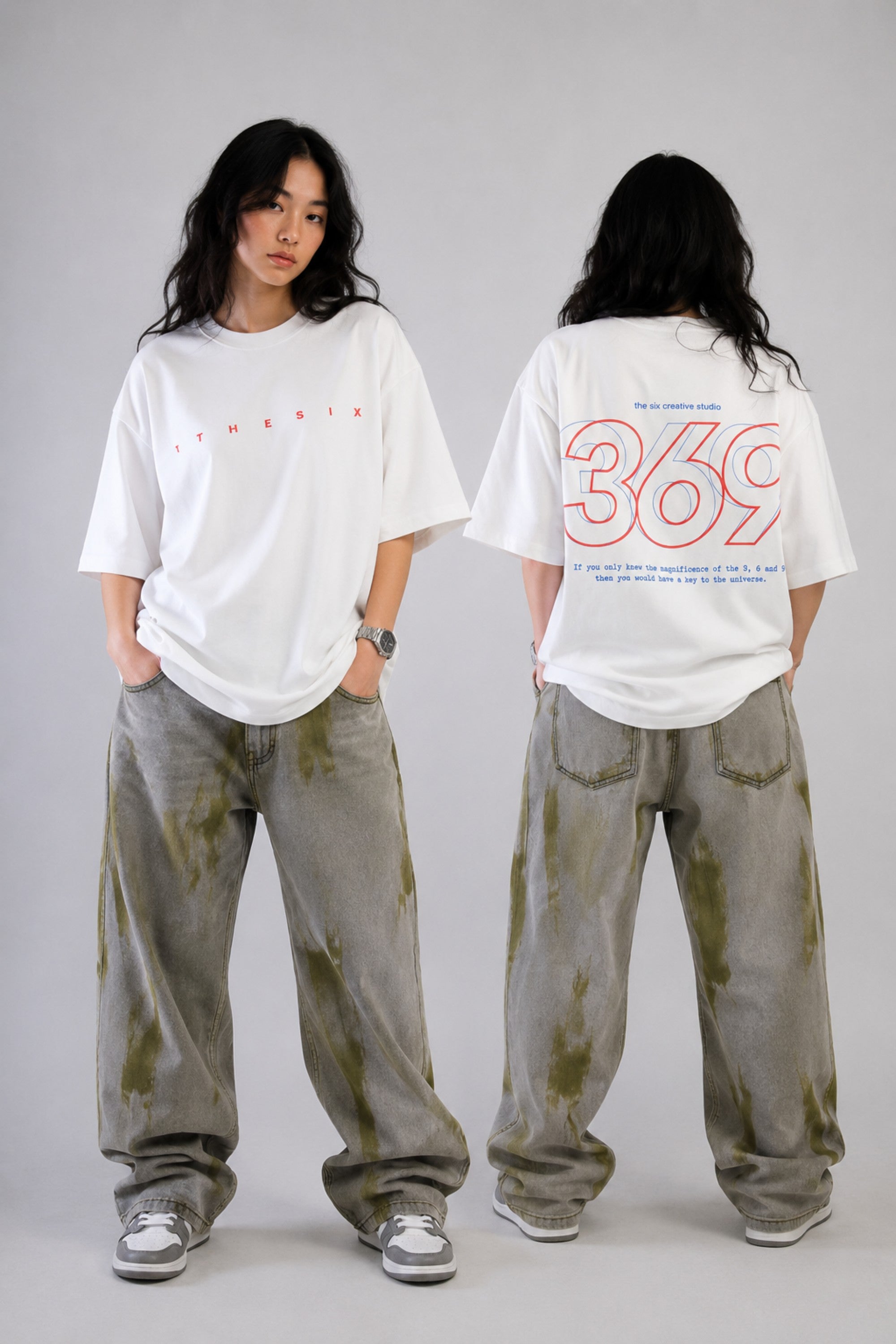 White oversized t-shirt from The Six Design featuring a bold red and blue graphic print of the numbers 3, 6, and 9. The t-shirt has a relaxed fit and is made of premium cotton.