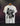 White Virat Kohli t-shirt with black and gray graphic design on a hanger against a dark background
