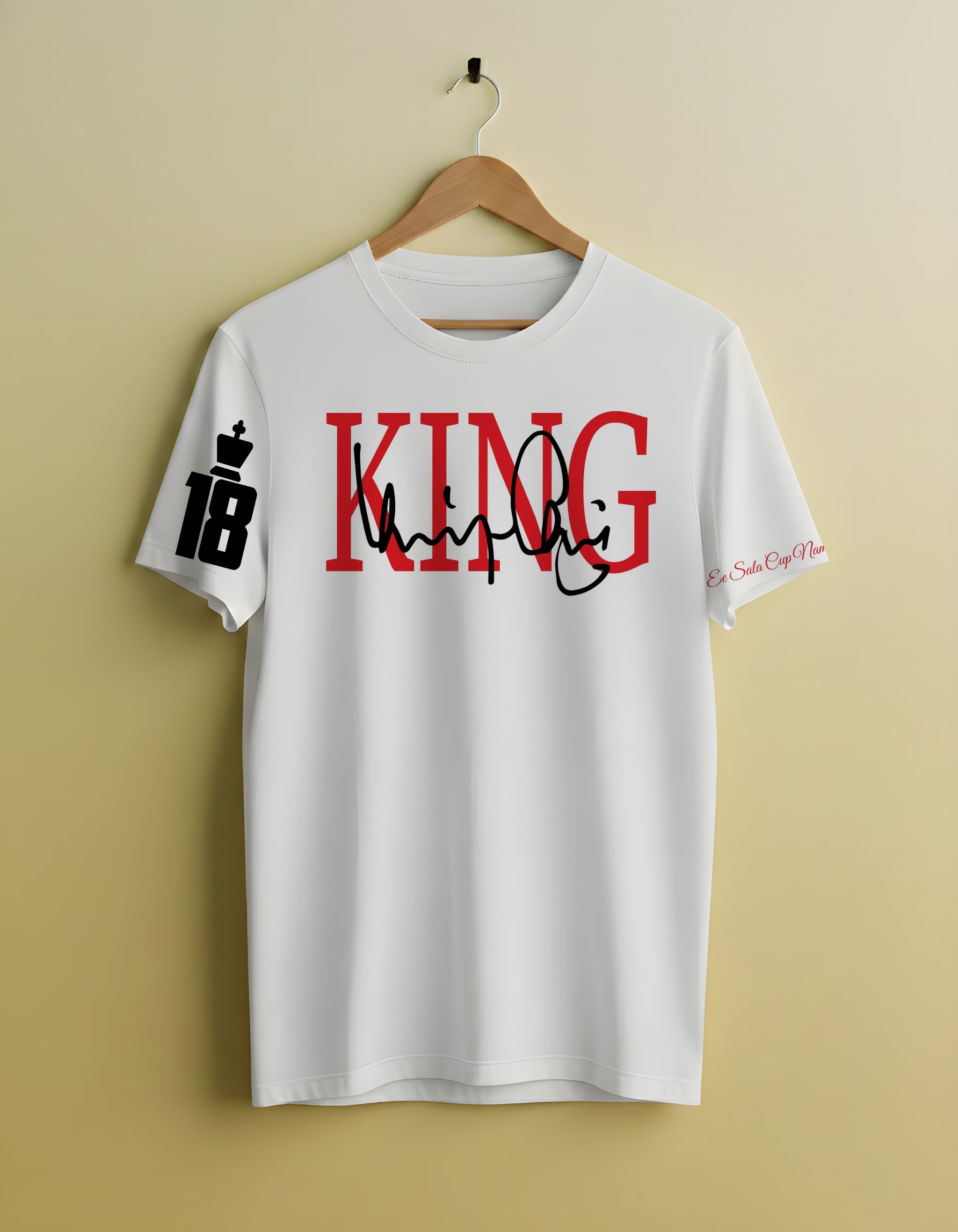 White t-shirt with 'KING' printed in red and black on a beige background