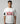 Person wearing a white t-shirt with 'KING 18' printed on it against a gray background